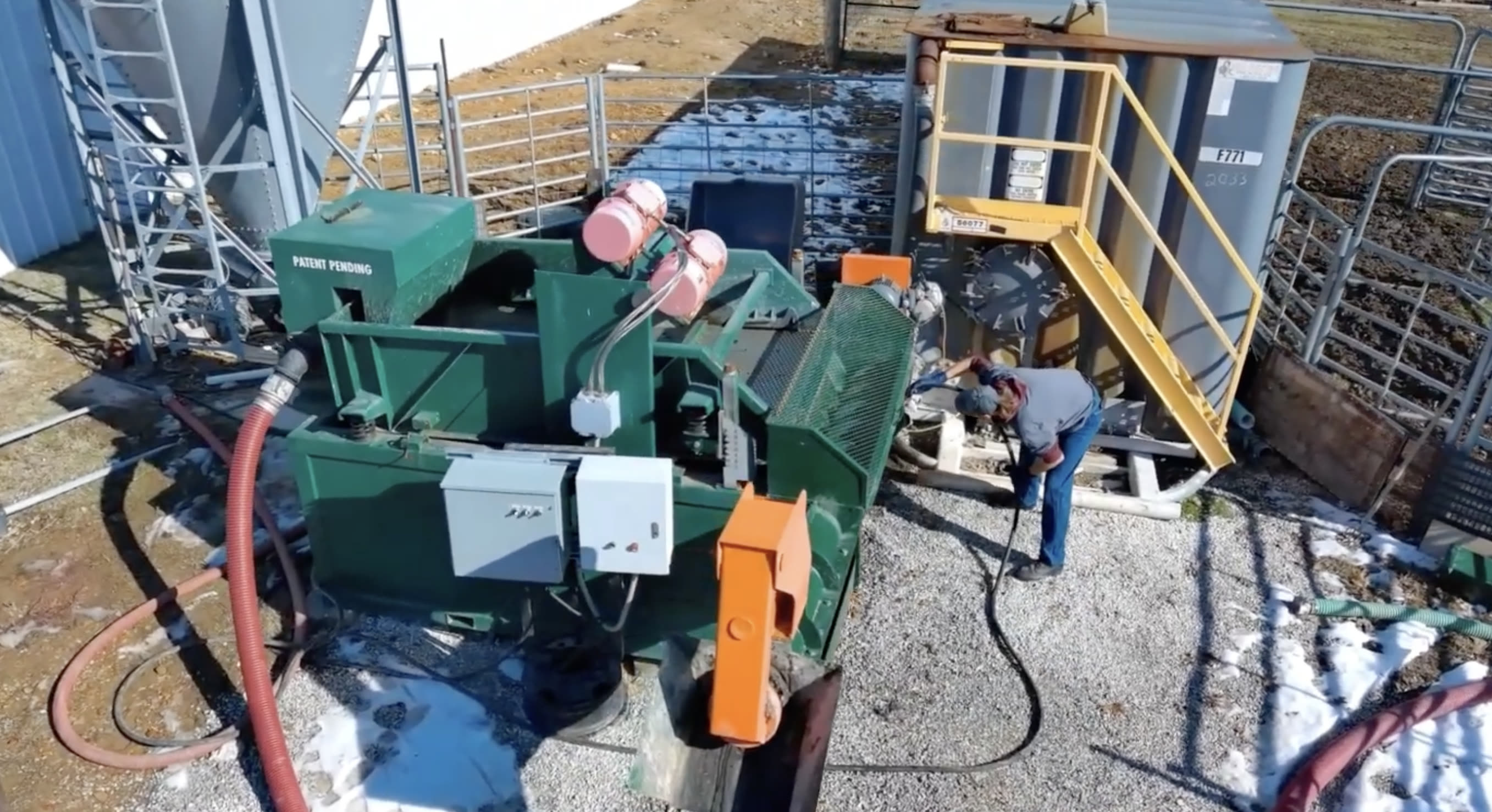 The Muckraker on a gravel pad with an operator